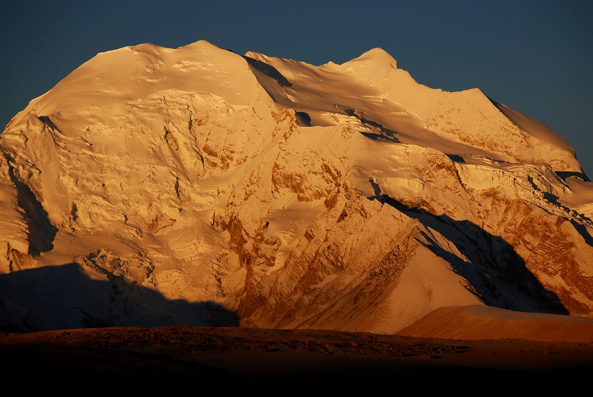 17 Gang Benchen Shines At Sunrise From Shishapangma North Base Camp Gang Benchen (7299m) is the most beautiful mountain at sunrise from Shishapangma North Chinese Base Camp (5029m).